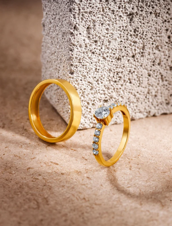 Gold rings on textured stone